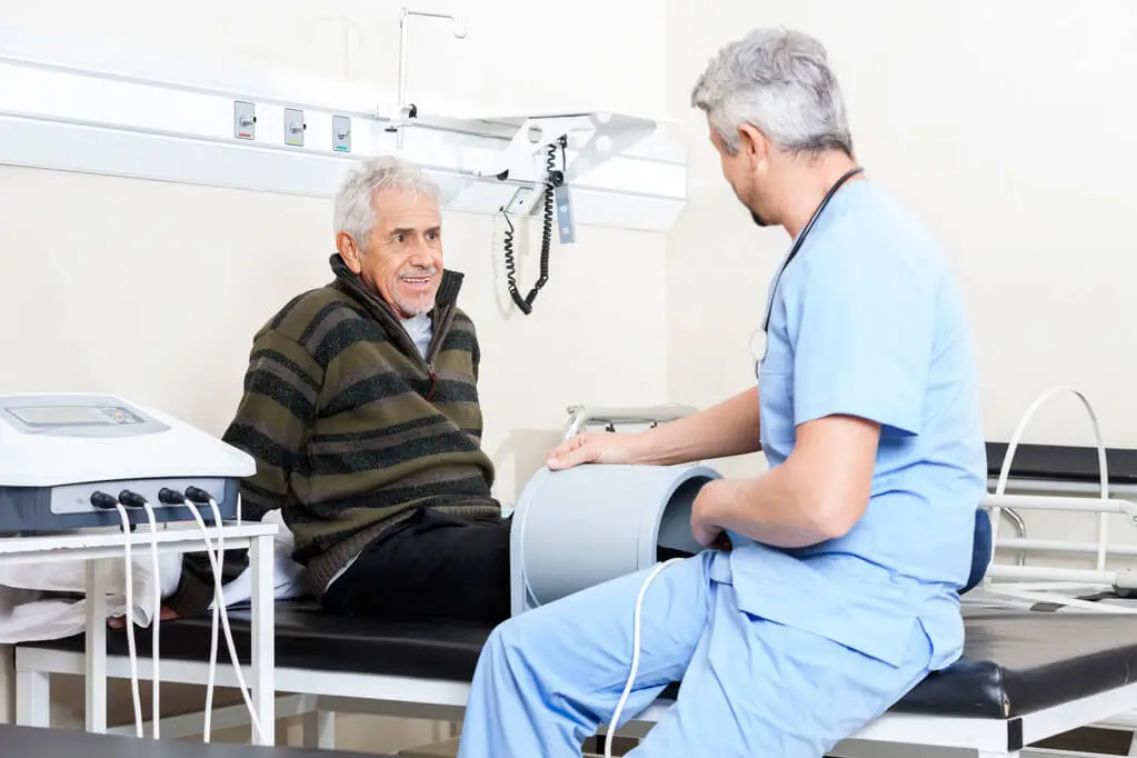 stock photo senior patient receiving electromagnetic therapy